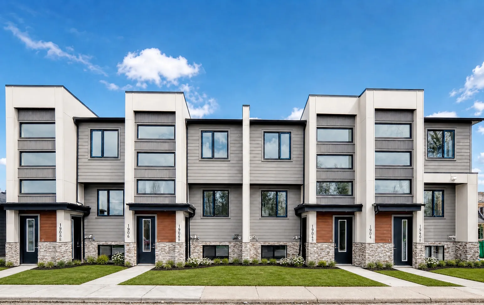 A row of modern Calgary townhomes built by our real estate group