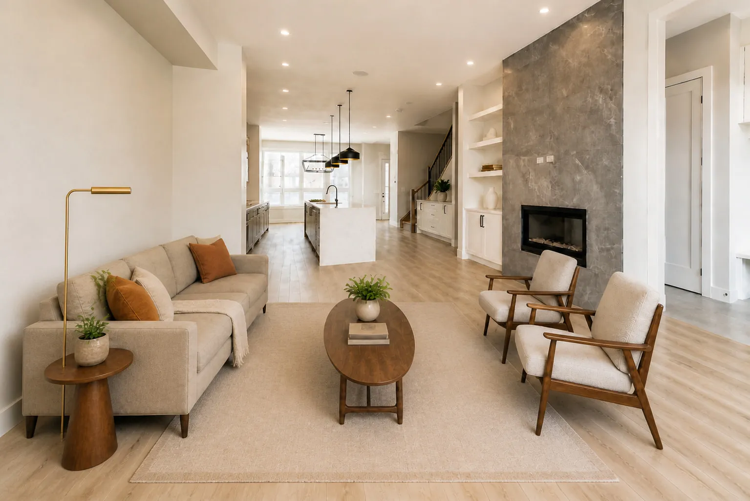 A living room with a slab fireplace opening onto the kitchen in a Calgary rental property