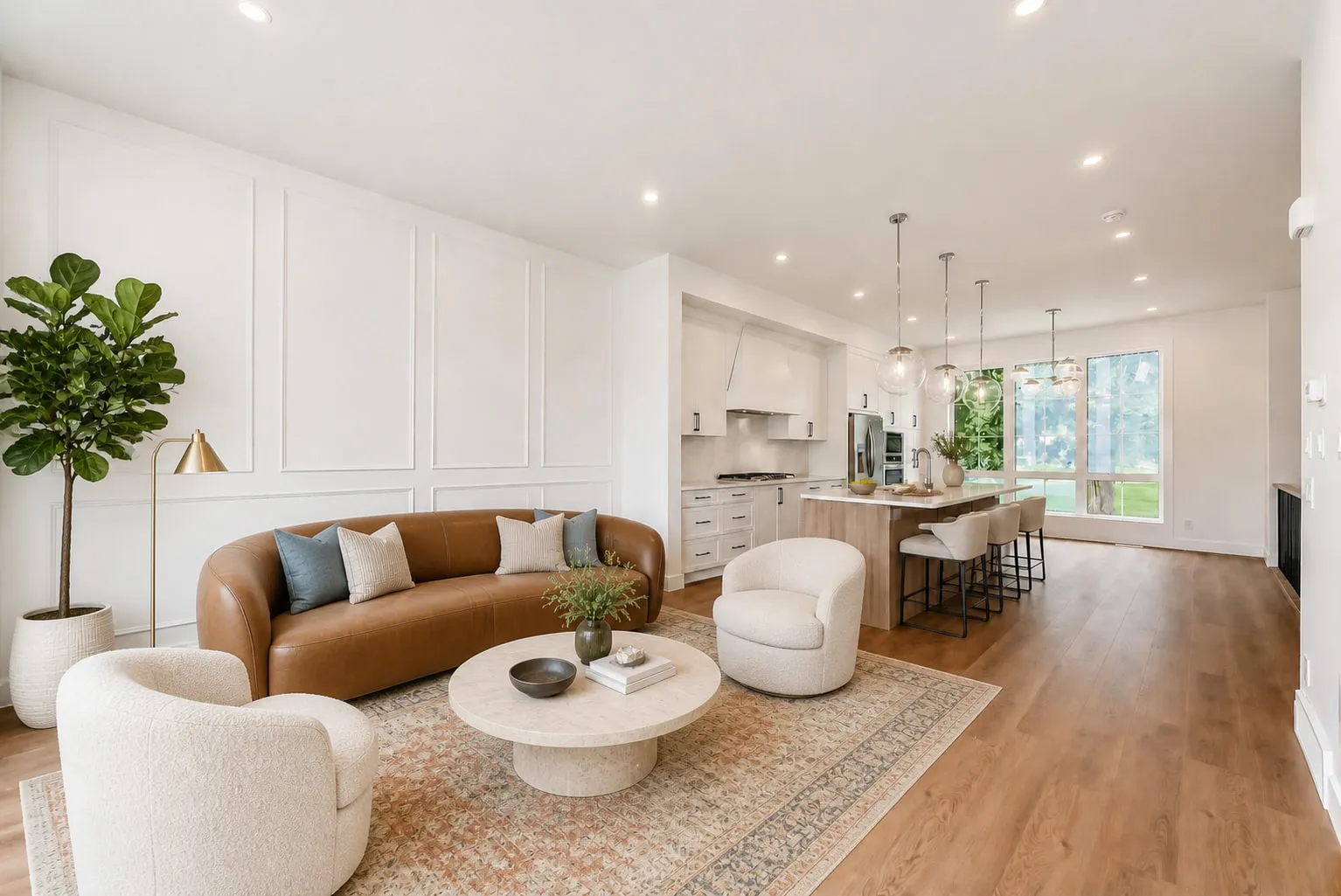 The open-concept living room and kitchen of a Calgary home built by our real estate group