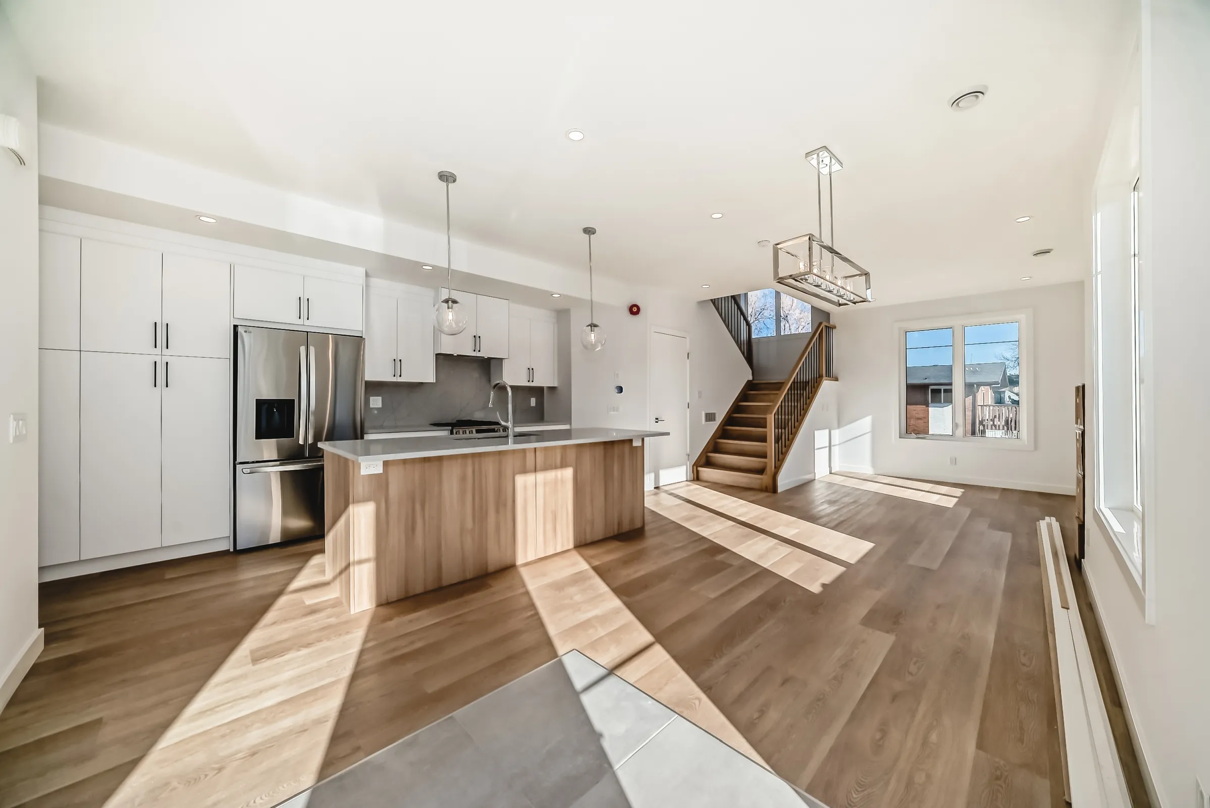 A sunlit open-concept kitchen in a Calgary rental home prepared for new tenants